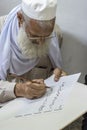 Calligraphy expert on his work