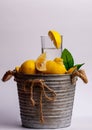 Picture on a white background with a cauldron that is full of the fruit called lime. In the center of the fruit is a Royalty Free Stock Photo