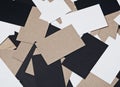 Picture of white, black and craft business cards on wood table.