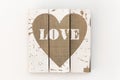 Picture of white wooden boards and painted brown heart