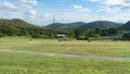 Picture of a wide area for ATV driving, with a fence made of car tires on the side. Royalty Free Stock Photo