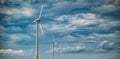 Picture of wind farm generators in the yellow field Royalty Free Stock Photo
