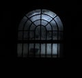 Picture of a window at night time with some creepy lights