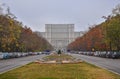 Parliament house and Unirii boulevard in Bucharest dressed in autumn vibrant colors, prepare for Christmas Market. Royalty Free Stock Photo