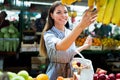 Picture of woman at marketplace buying fruits Royalty Free Stock Photo