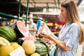 Picture of woman at marketplace buying fruits Royalty Free Stock Photo