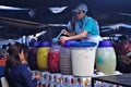 Picture of a woman serving Aguas frescas in a Honduras Market Tegucigalpa Royalty Free Stock Photo