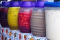 Picture of a woman serving Aguas frescas in a Honduras Market Tegucigalpa 2