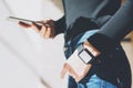 Picture Woman Working Modern studio,Wearing Generic Design Smart Watch.Female Hands Touching screen mobile phone.Manager Royalty Free Stock Photo