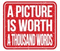 A PICTURE IS WORTH A THOUSAND WORDS, words on red stamp sign Royalty Free Stock Photo