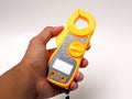 Picture of yellow digital clamp meter that using for measuring electrical current, voltage and resistance Royalty Free Stock Photo