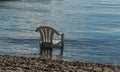 A white plastic chair in the sea