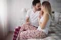 Picture of young attractive couple kissing on bed Royalty Free Stock Photo