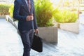 Picture of a young business man walking forward with a briefcase Royalty Free Stock Photo