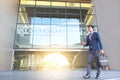 picture of a young business man walking forward with a briefcase Royalty Free Stock Photo