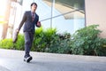 picture of a young business man walking forward with a briefcase Royalty Free Stock Photo