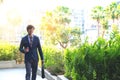 picture of a young business man walking forward with a briefcase Royalty Free Stock Photo