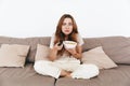 Concentrated amazing pretty lady watch TV. Royalty Free Stock Photo