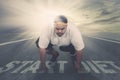 Young fat man kneeling above text of start diet