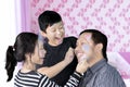 Father and children playing with face painting Royalty Free Stock Photo