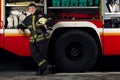 Picture of young fireman man near fire truck Royalty Free Stock Photo