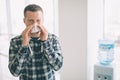 Picture from a young man with handkerchief. Sick guy has runny nose. makes cure for the common cold. Royalty Free Stock Photo