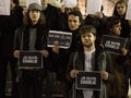 Young people holding `Je suis Charlie` signs during a demonstration to commemorate 7th of January attacks against Charlie Hebdo Royalty Free Stock Photo