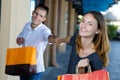 Picture young playful couple holding shopping bags Royalty Free Stock Photo