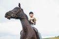 Picture of young pretty girl riding horse Royalty Free Stock Photo