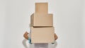 Picture of a young redhead deliveryman with three cardboard boxes Royalty Free Stock Photo