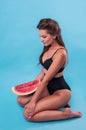 Picture of young woman holding a big slice watermelon Royalty Free Stock Photo