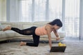 Woman looking at her smartwatch during exercise Royalty Free Stock Photo