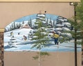 `10th Mountain Hut` by Mason Torry on the outside of a business in a shopping mall in Avon, Colorado.