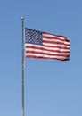 American flag flying in a brisk wind in the historic neighborhood Greenway Park in Dallas, Texas.