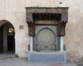 Ancient Arabic mosaic fountain at one of the entrances to the Souk Myknes, Morroco.
