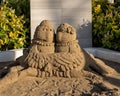 Anthropomorphic sand sculpture in a sandbox at a resort on the Island of Maui in the state of Hawaii.