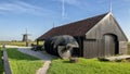 Archimedes screw, storage house and windmill by the Schermerhorn Museum Mill, Stompetoren, Netherlands Royalty Free Stock Photo