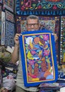 Artisan showing a piece of his work in his shop on the Street of the Tentmakers in Cairo, Egypt. Royalty Free Stock Photo