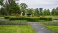 Asphalt walkway and garden with a currently non-functional fountain near the Jewel Box in Forest Park in Saint Louis, Missouri. Royalty Free Stock Photo