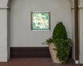 Bright picture of jaquar chasing a monkey and decorative planter with ivy and a cone shaped bush in Dallas, Texas