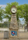 Bad Koenigshofen clock atop stone pillar with city emblem on base at the Aquatic Center in S. J. Stovall Park in Arlington, Texas.
