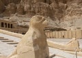 Balustrade adorned with a Horus statue at the Mortuary Temple of Hatshepsut near Luxor, Egypt. Royalty Free Stock Photo