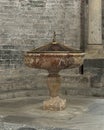 Baptismal with small sculpture of John the Baptist baptizing Jesus Christ in the Church of Santa Maria del Tiglio in Gravedona.