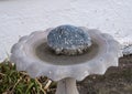 Bird bath with engraved Welcomed stone at the historic Saint Joseph Catholic Church in Fort Davis, Texas.