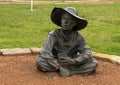 Boy in a Cowboy camp, part of the longest bronze sculpture collection in the United States in The Center at Preston Ridge. Royalty Free Stock Photo