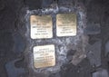 Brass plaques memorializing the death of a deported