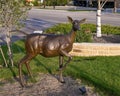 Doe standing with front foot lifed, part of `A Wilderness Welcome` by Archie Saint Clair in the historic district of Grapevine