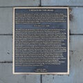 Information plaque for `A Bench By the Road` outside Greenwood Rising history center in Tulsa, Oklahoma.