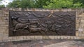 The Shawnee Trail, a bronze relief mural by Anita Pauwels, part of a public art installation titled `Cattle Drive` in Central Park Royalty Free Stock Photo