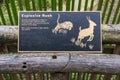 Bronze relief of tiger explosively rushing its prey at the Dallas City Zoo in Texas.